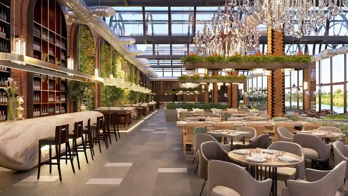 15 Romantic Things To Do in New Haven For Couples in 2024 6 A spacious, modern restaurant with high ceilings and large windows letting in natural light. The interior features contemporary chandeliers, a mix of upholstered chairs and wooden tables, a long bar with stools, and abundant greenery throughout the space.