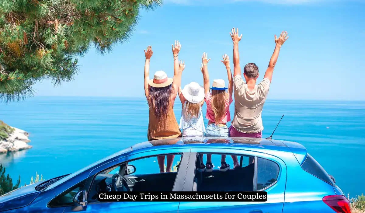 15 Free Romantic Things to Do in Massachusetts for Couples 18 Four people sit on a blue car roof, facing the ocean with raised arms, enjoying a scenic view. Pine trees frame the left side, and a clear blue sky is above. Text at the bottom reads, "Cheap Day Trips in Massachusetts for Couples.