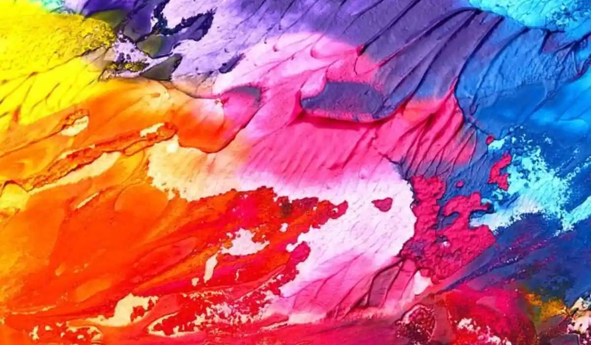 The 10 Best Interactive Museums in NYC You Must Visit  5 A vibrant abstract painting with swirling colors in yellow, orange, pink, red, purple, and blue, creating a textured and dynamic appearance. The colors blend seamlessly in a fluid motion.