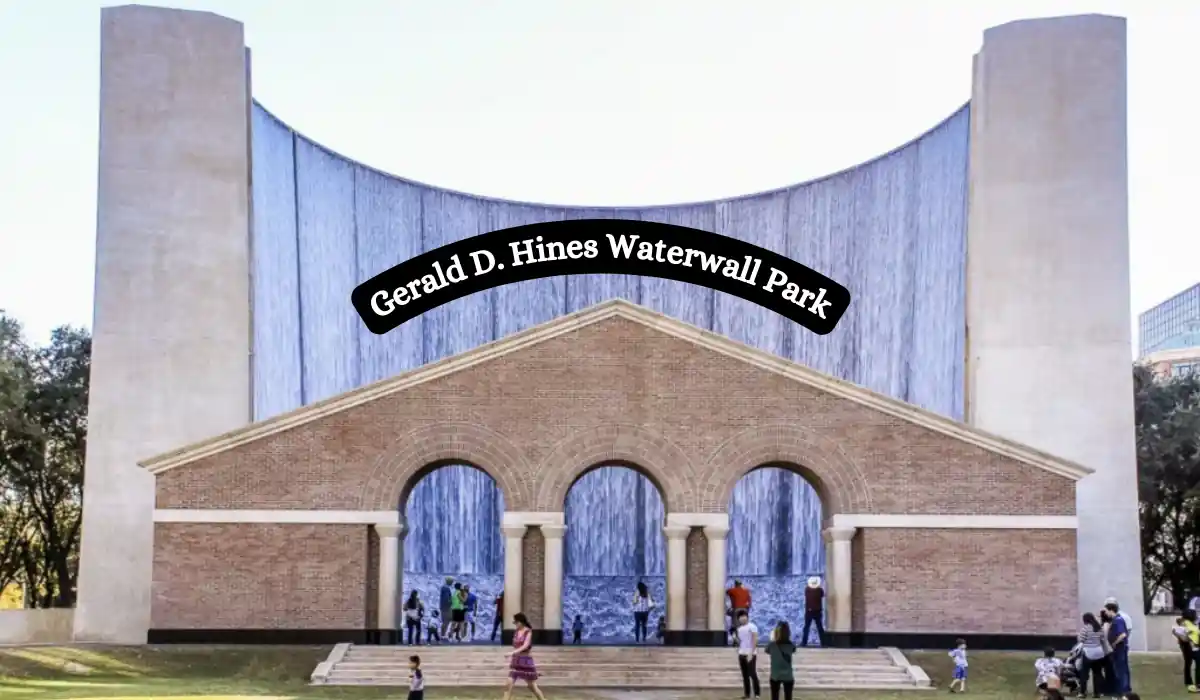 15+ Fun and Romantic Things To Do In Houston for Couples 10 A large architectural structure with cascading waterfalls is labeled Gerald D. Hines Waterwall Park. People gather around the arches and brick facade, enjoying the outdoor setting. Trees frame the background.