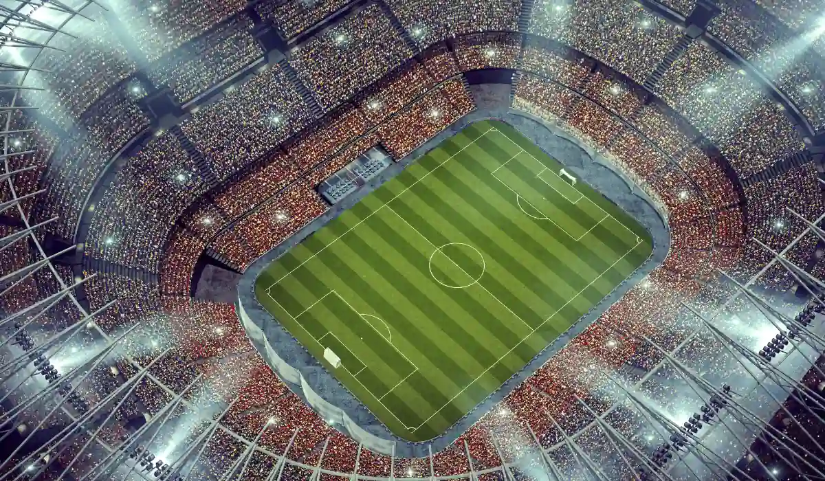 15+ Fun and Romantic Things To Do In Houston for Couples 9 A brightly lit stadium packed with a large crowd, centered on a lush green soccer field under evening lights. The view is from above, showcasing the rectangular field, surrounding stands, and a vibrant atmosphere.