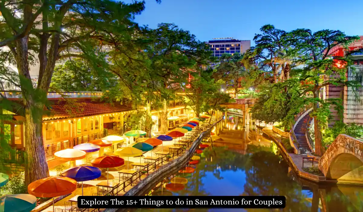 Scenic view of San Antonios River Walk at dusk, featuring brightly colored umbrellas lining the riverside cafes and restaurants, with lush green trees and warm, inviting lights reflecting on the water. "Things to do in San Antonio for Couples"