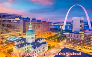 Aerial view of downtown St. Louis at dusk, featuring the Old Courthouse and Gateway Arch. Buildings and streets are illuminated against a colorful sky. Text at the bottom reads, Best Things To Do in St Louis this Weekend.