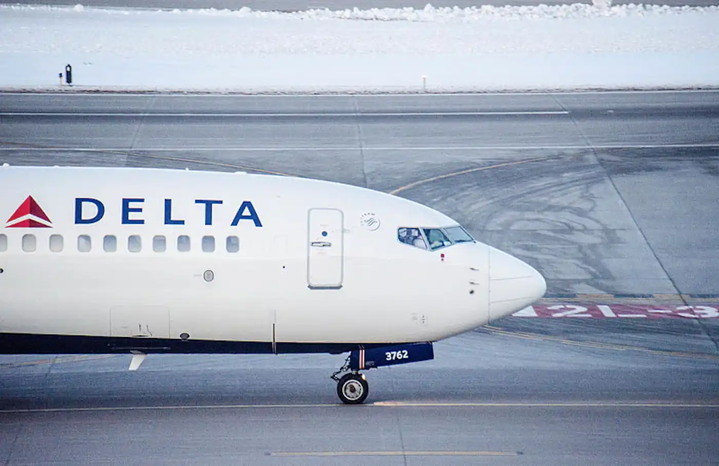 Exclusive: Delta Flight Dog Diversion MSP Shocks Travelers (2025) 58 Exclusive Delta Flight Dog Diversion MSP Shocks Travelers (2025) A Delta Air Lines airplane taxiing on a runway, photographed from the side, with snow visible in the background.